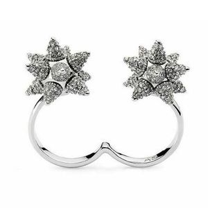 ATELIER SWARVOSKI KALIX CRYSTAL SPIKE TWO FINGER RING IN SILVER.